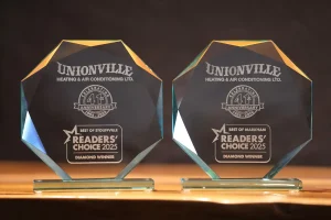 Unionville Heating and Air Conditioning Readers' Choice 2025 Diamond Winner glass trophies for Best of Markham and Best of Stouffville, celebrating 41 years of service.